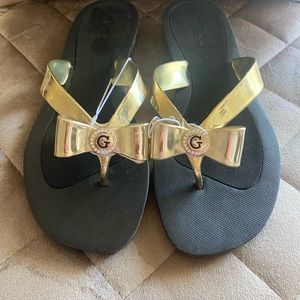 Guess Black and Gold with a Bow Sandals Size 8 Flip Flops